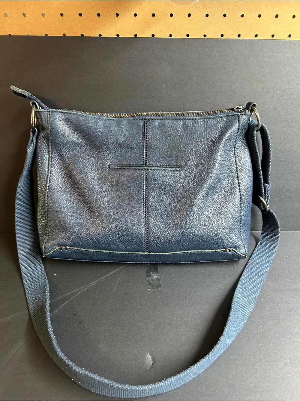 The‎ Sak Navy Leather Crossbody with Mint Interior